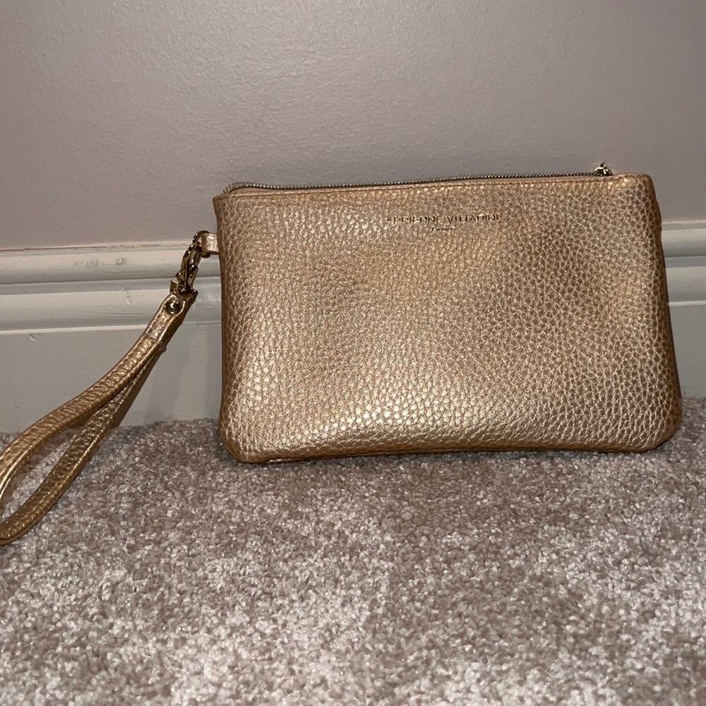 Small gold clutch purse with attached phone charger